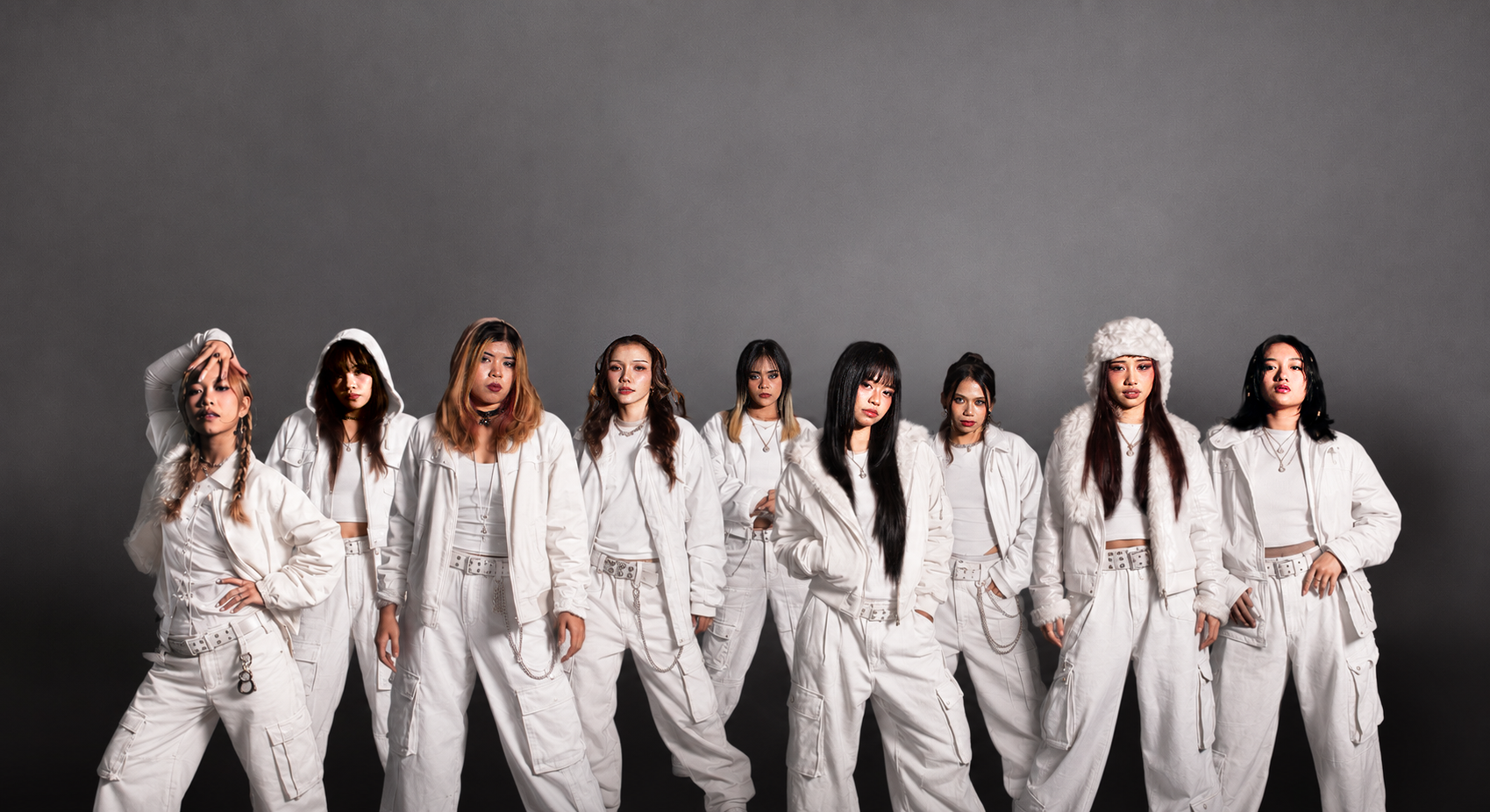 ALPHA dance group in coordinated white outfits
